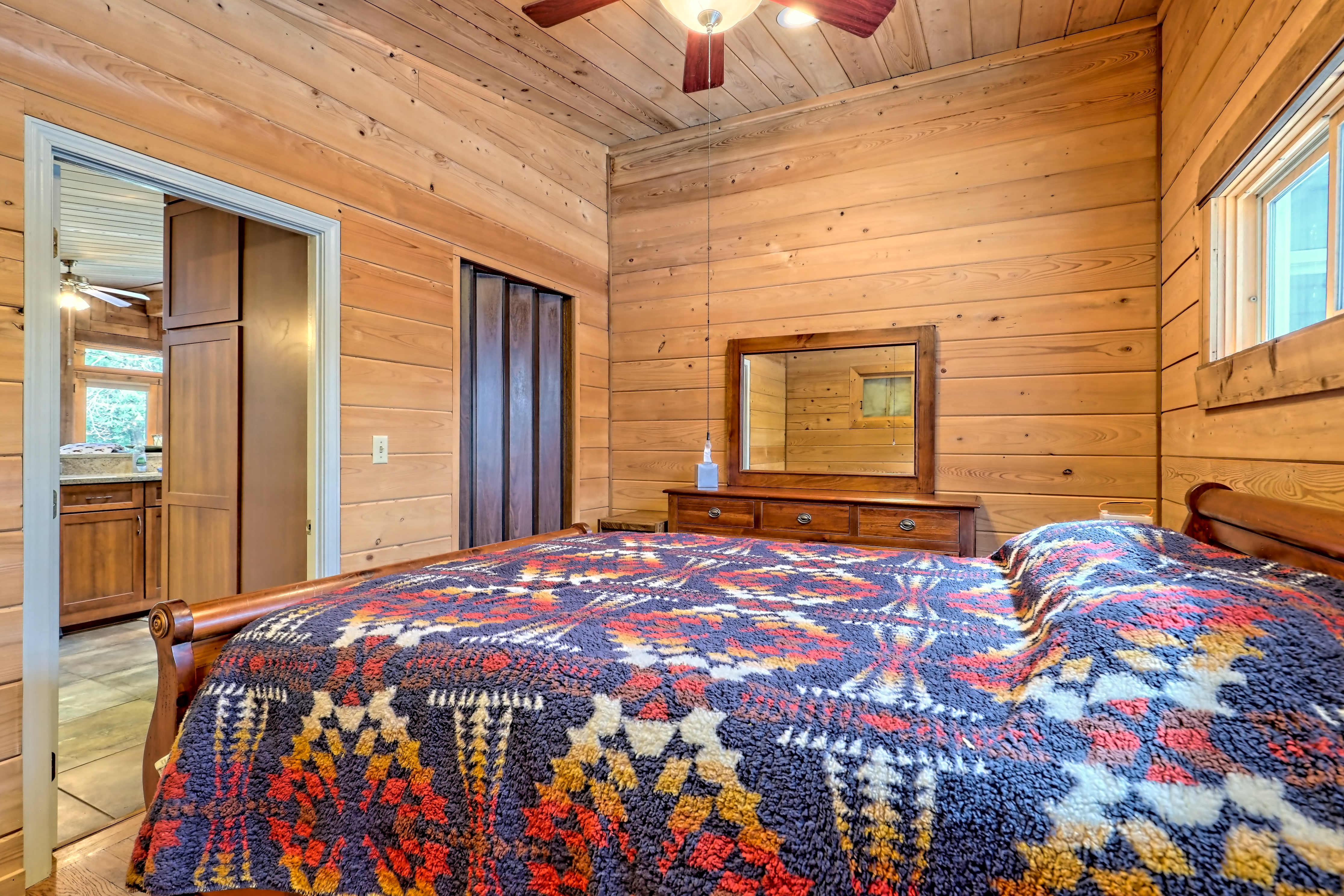 Cozy wood-paneled bedroom